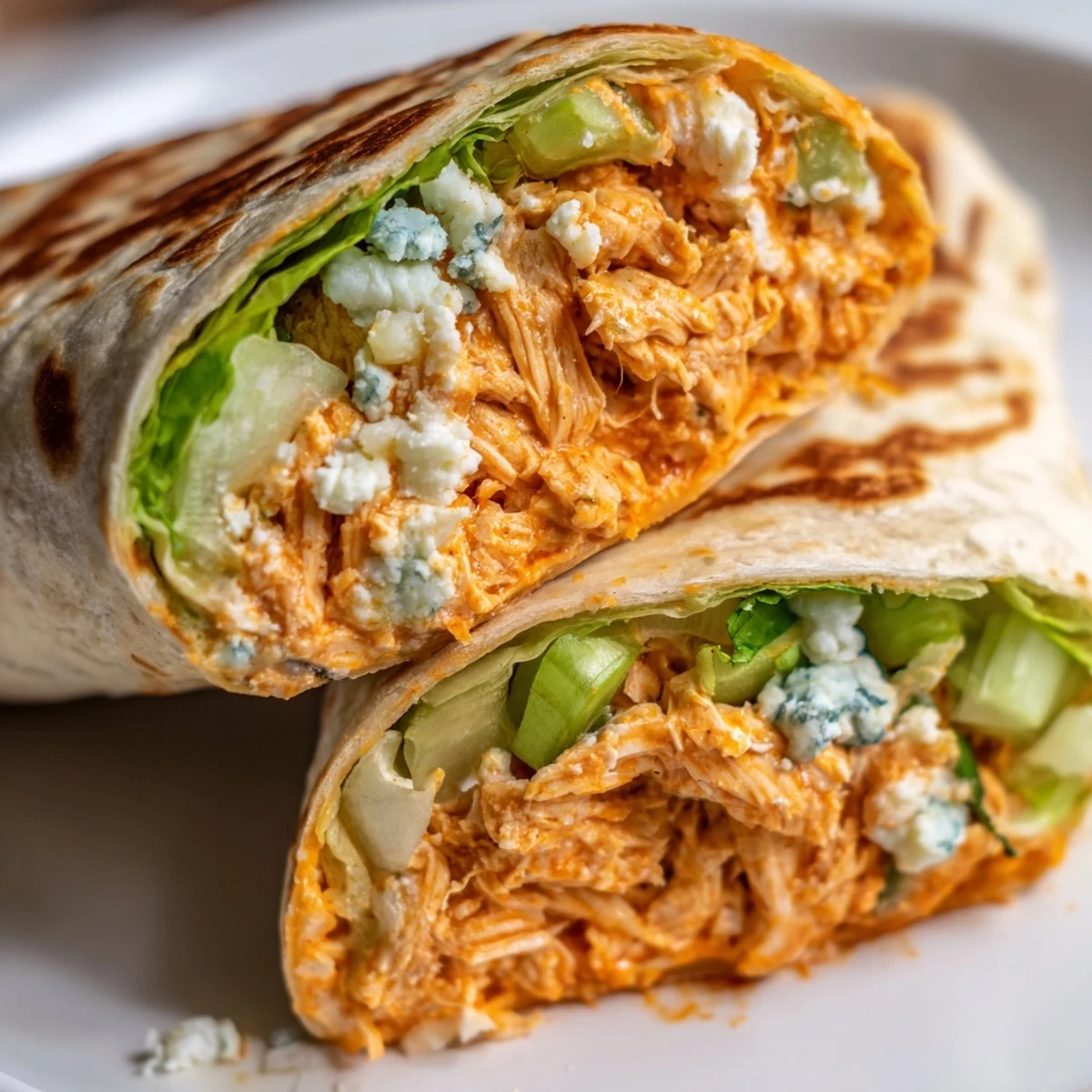 Golden-brown Buffalo Chicken Dip Wrap, with melty cheese and tender chicken, ready to eat.