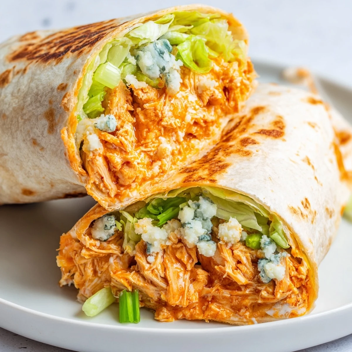 Freshly grilled, warm Buffalo Chicken Dip Wraps, perfect for a quick, flavorful lunch or snack.