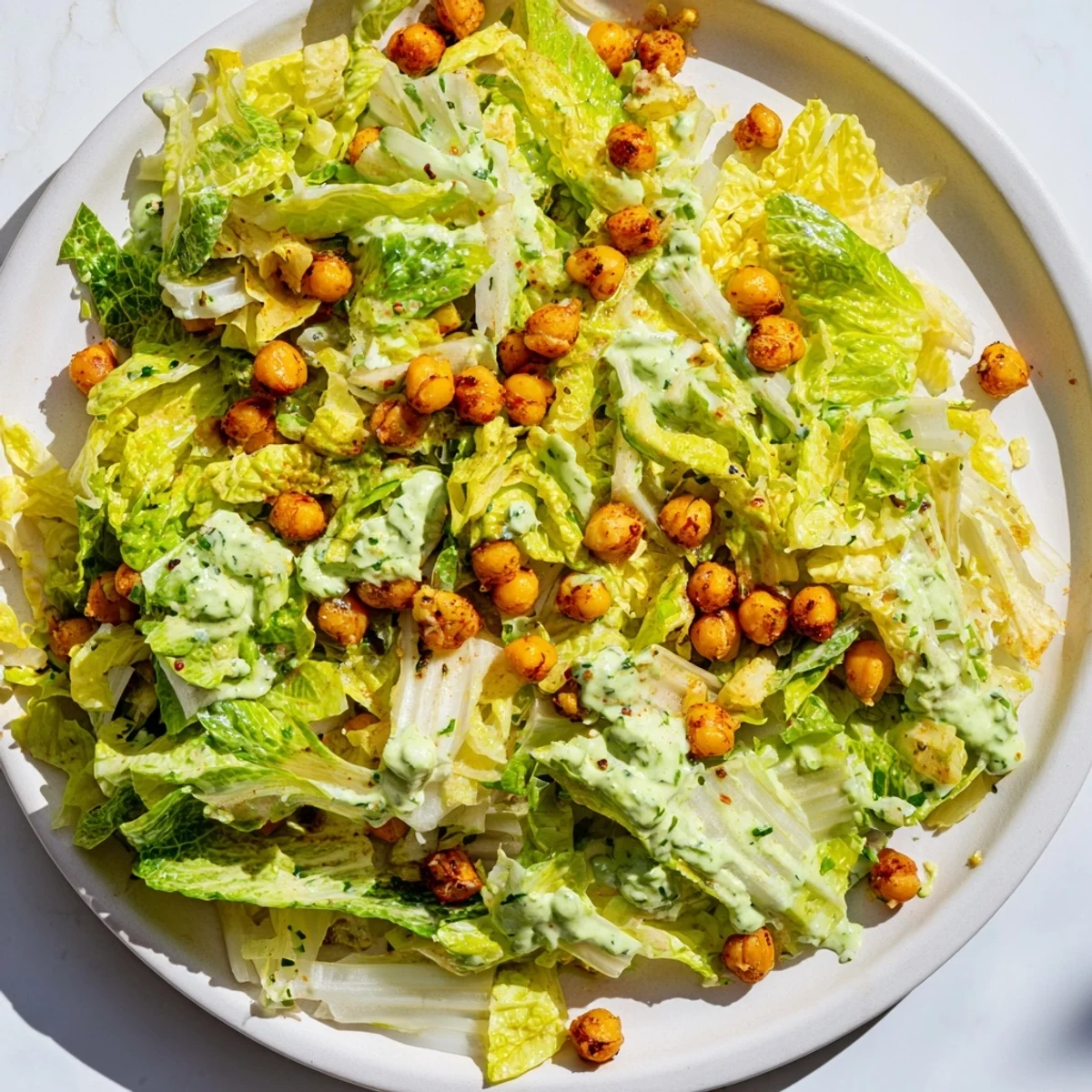 Green Goddess Salad with crispy chickpeas, a colorful vegetarian salad with appealing textures and fresh herbs.