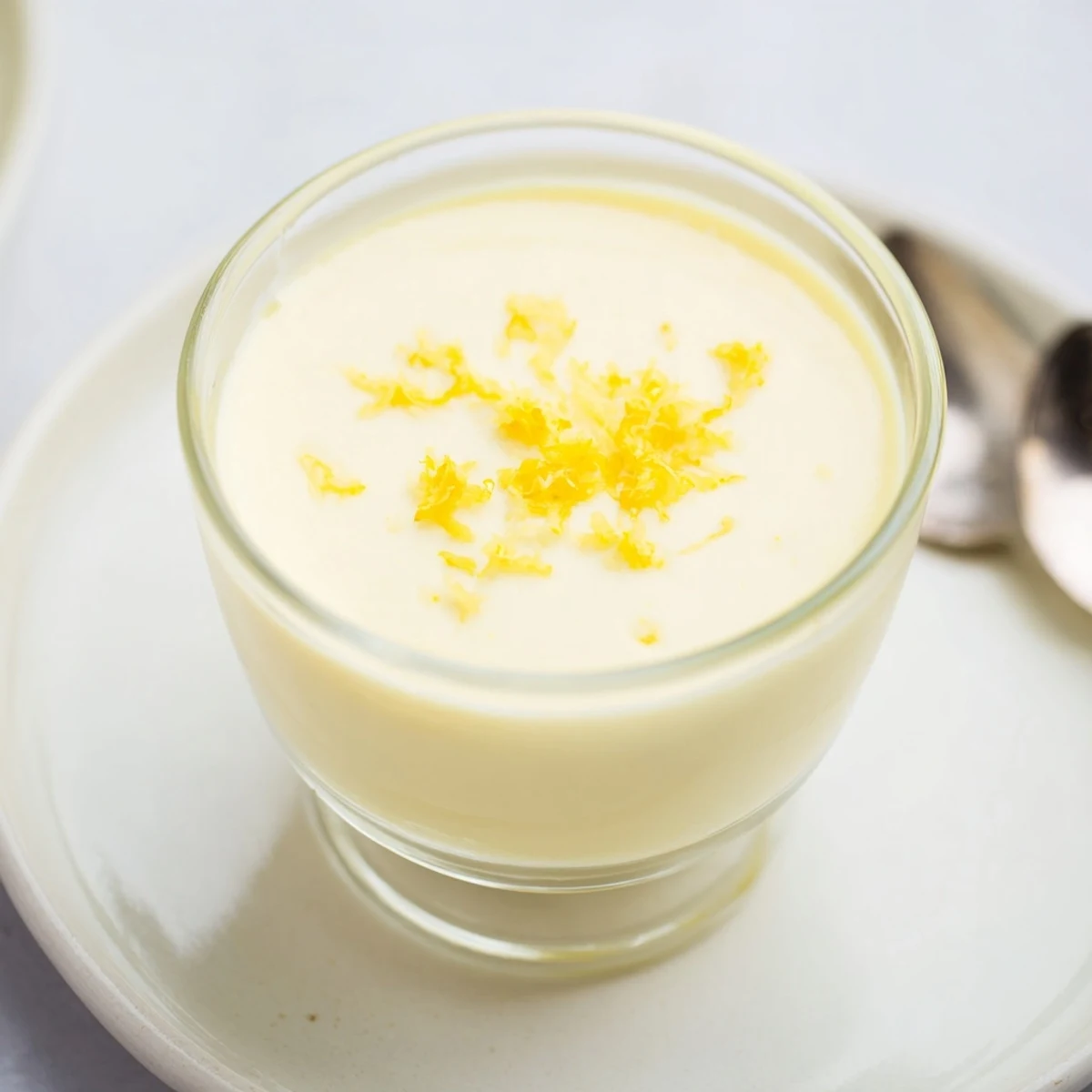 Cool, luxurious 3-Ingredient Lemon Posset, chilled until perfectly set in elegant serving glasses, ready to enjoy.