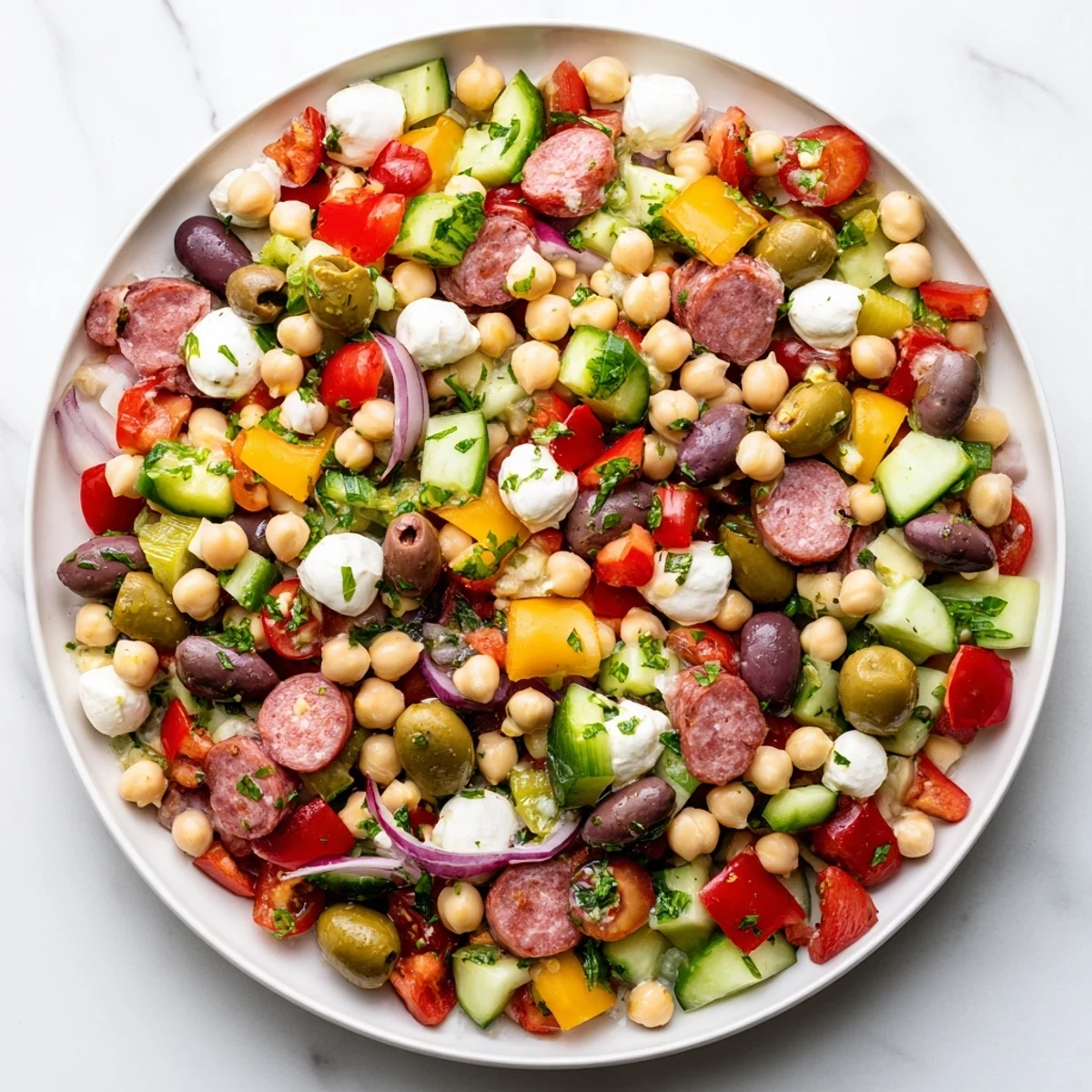 Crunchy Antipasto Chopped Salad features vibrant chickpeas, salami, and mozzarella tossed in zesty Italian dressing.