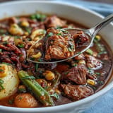 Thick, savory Kentucky Derby Burgoo Stew brimming with tender meats and vegetables.