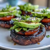 Juicy grilled portobello mushroom burgers piled high with fresh toppings.