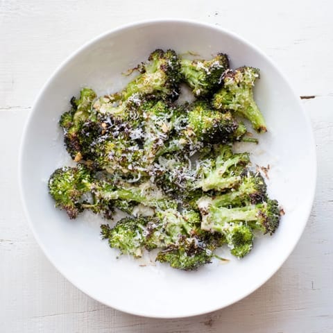 Crispy, flavorful Simple Garlic and Parmesan Roasted Broccoli; a delicious, easy vegetarian side.