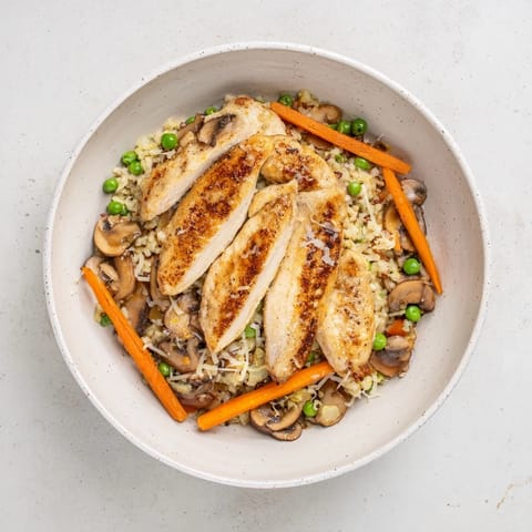 Perfect for a weeknight, this All-in-One Pan Creamy Chicken and Wild Rice features golden chicken and colorful vegetables.