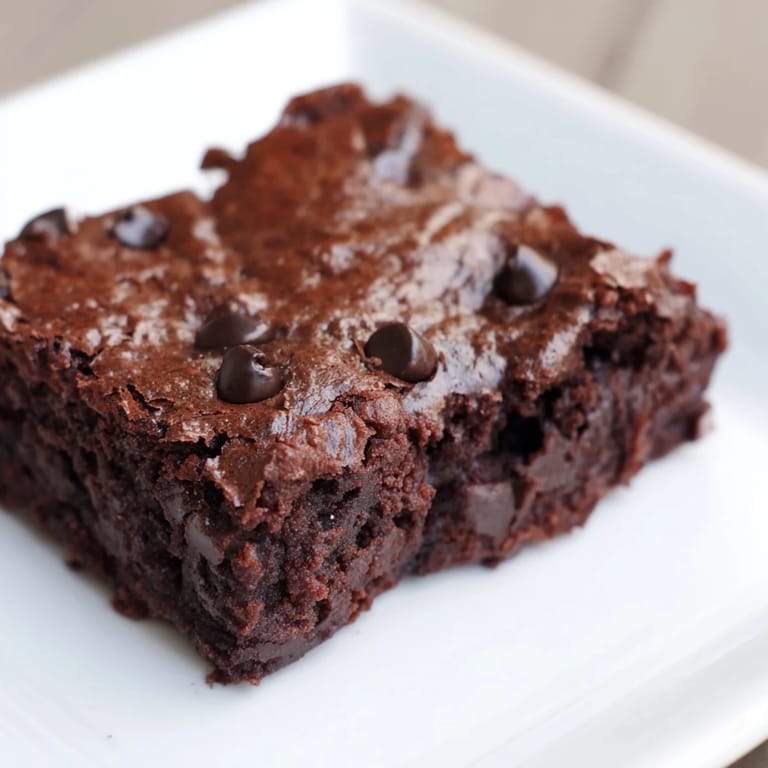 Dark and delicious Greek yogurt brownies, offering a delightful mix of flavors and textures, ready to enjoy.