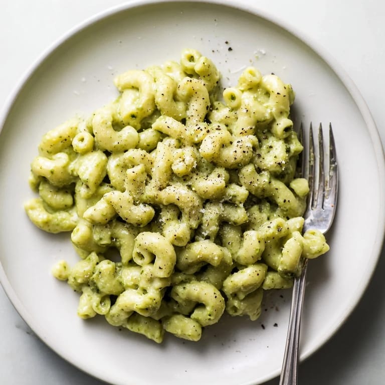 Fresh basil and ripe avocado blend into a luscious sauce for this Creamy Avocado Pesto Mac.  