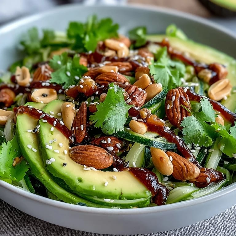 A refreshing salad featuring vibrant celery slices, crunchy peanuts, and a zesty soy ginger dressing, perfect for a light meal.  